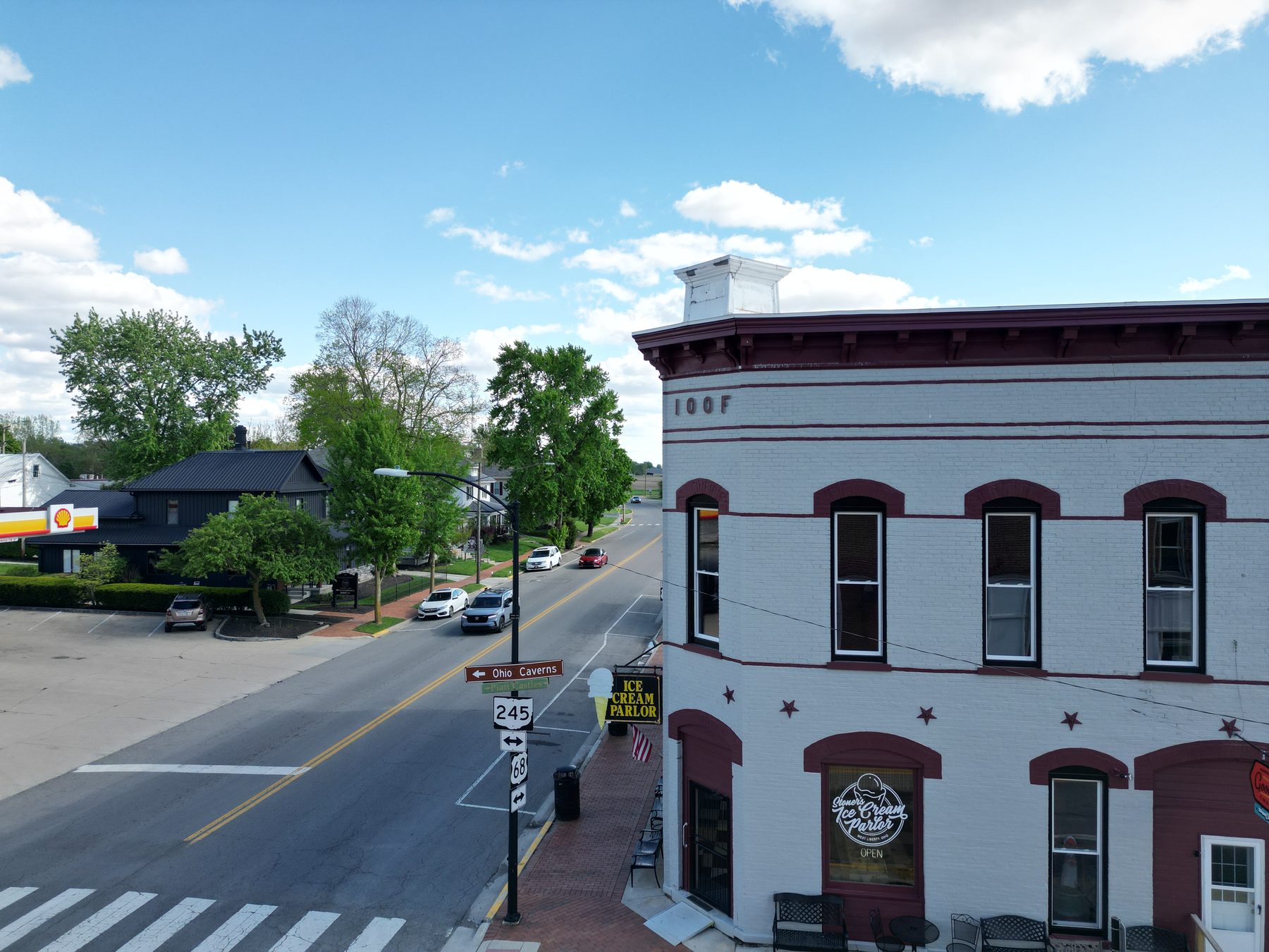 The corner of US-68 and SR-245 in West Liberty, Ohio, with the IOOF hall and Signer's Ice Cream Parlor.